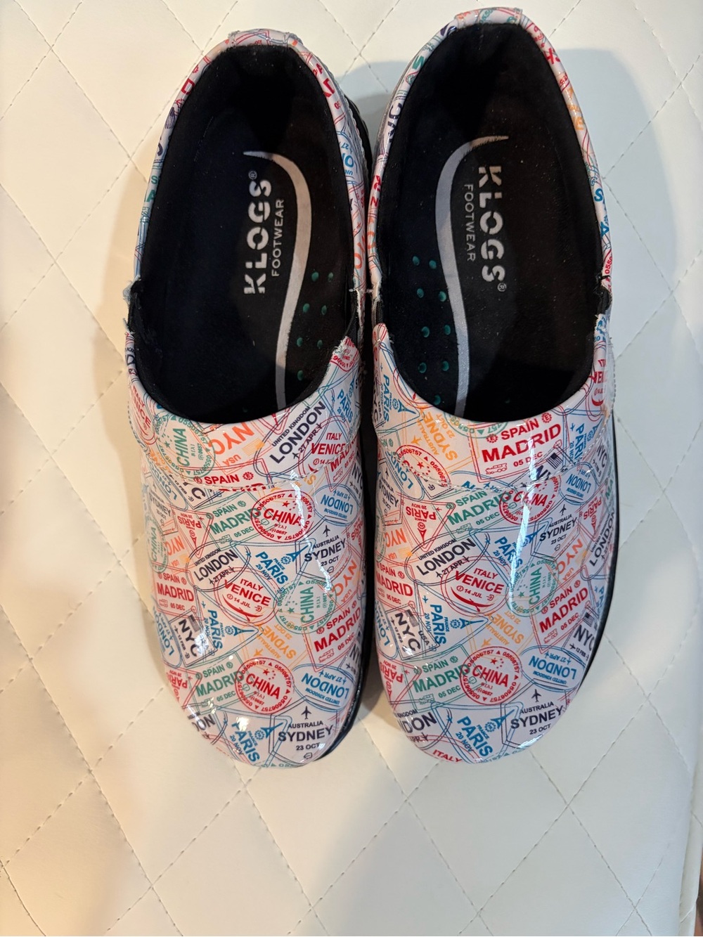 Klogs Women's Slip-On Mules in White with Multicolor Travel Stamp Print